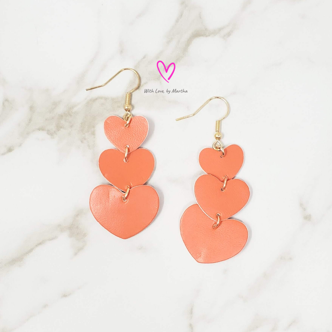 Orange vegan leather hearts teardrop earrings